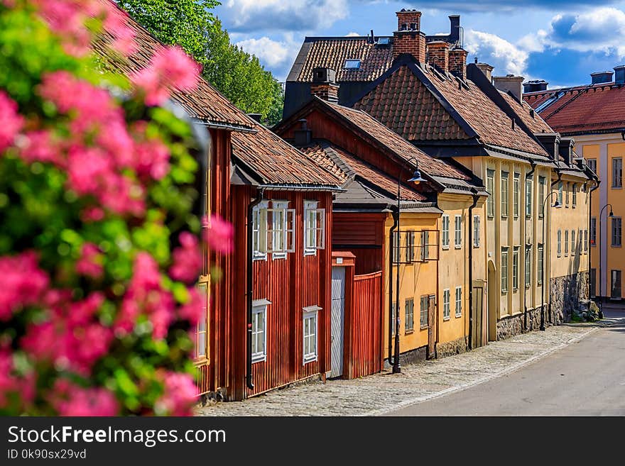 Traditional swedish old houses with flowers in the foreground in the heart of Stockholm, Sweden. Traditional swedish old houses with flowers in the foreground in the heart of Stockholm, Sweden