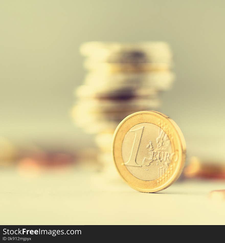 Euro money, currency. Success, wealth and poverty, poorness concept. Euro coins stack on grey background with copy space.