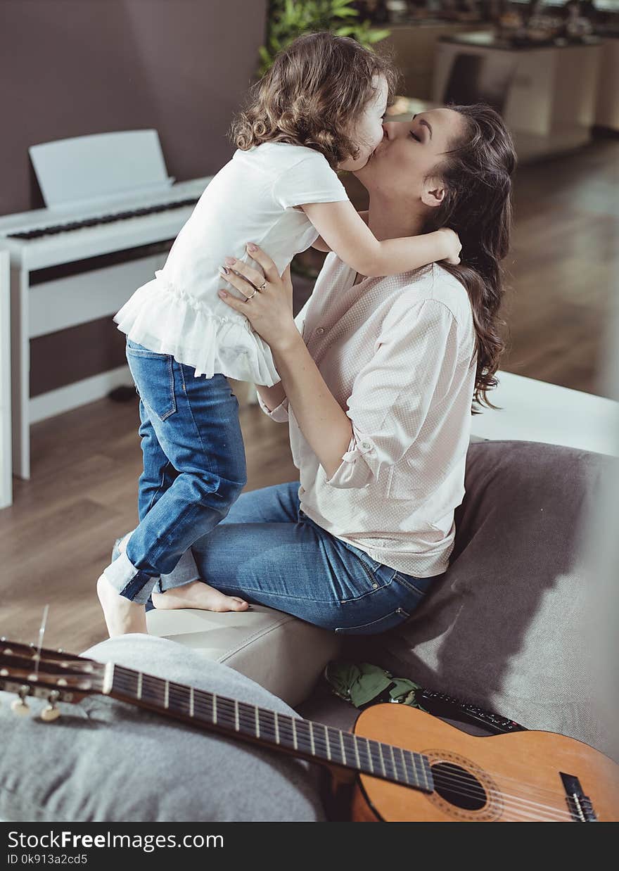 Happy mother with a daughter at home