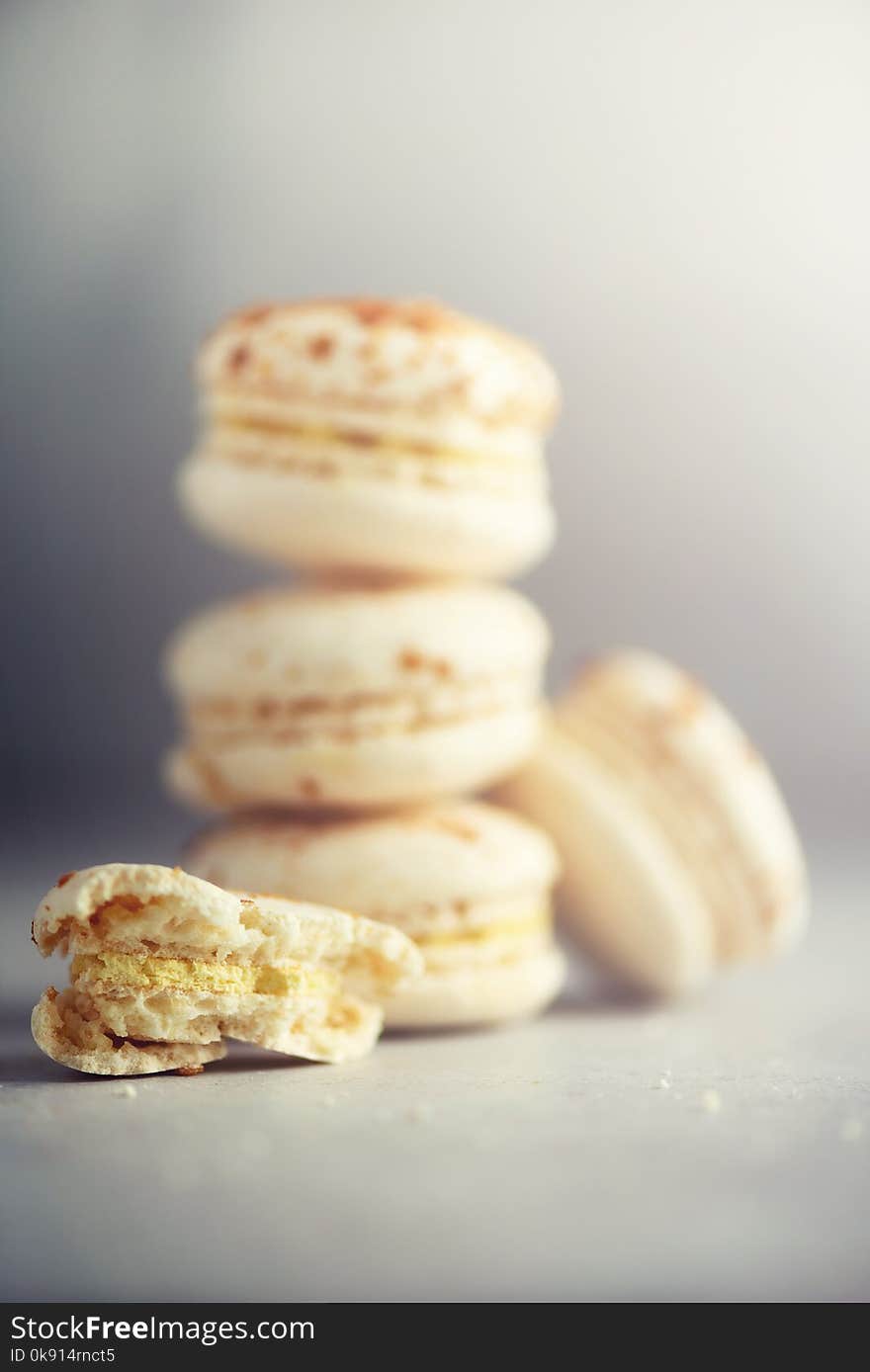 Vanilla caramel macarons, copy space. Holidays and celebrations concept. Sweet gift for woman, girl.