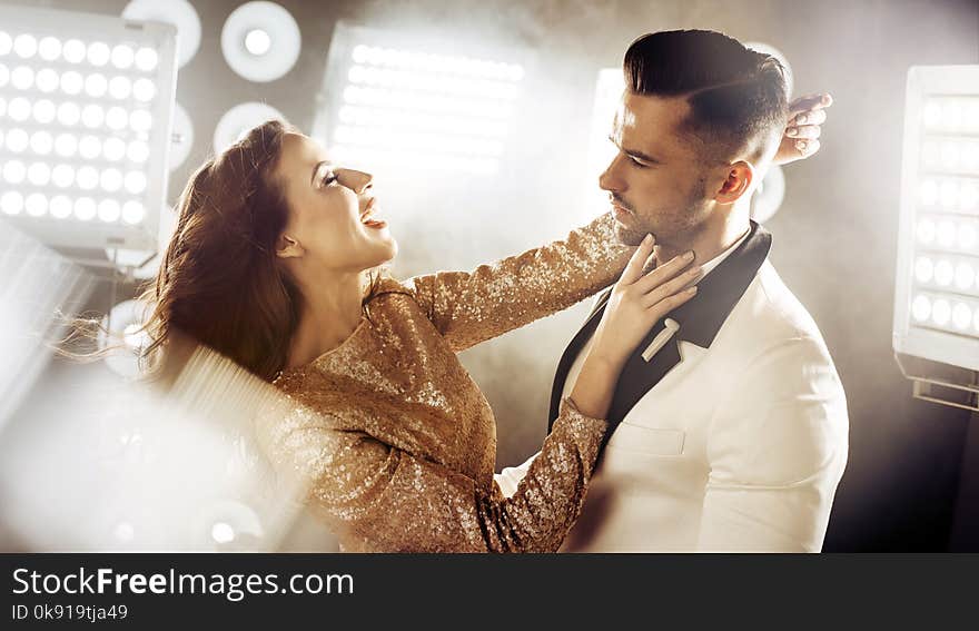 Portrait of the dancing, elegant couple on a party