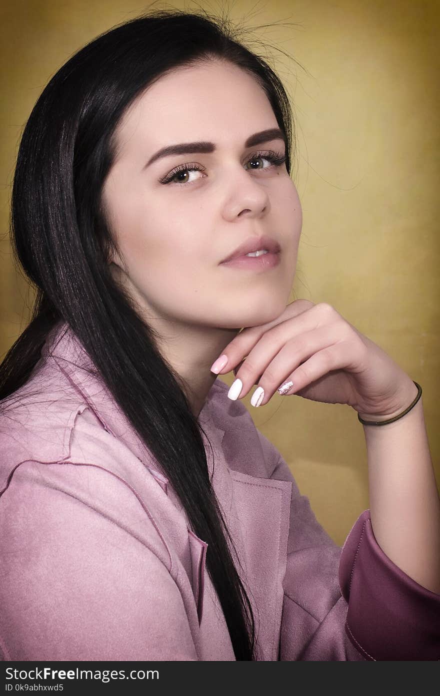 Portrait of beautiful young brunette woman on Yellow Background, closeup. Portrait of beautiful young brunette woman on Yellow Background, closeup.