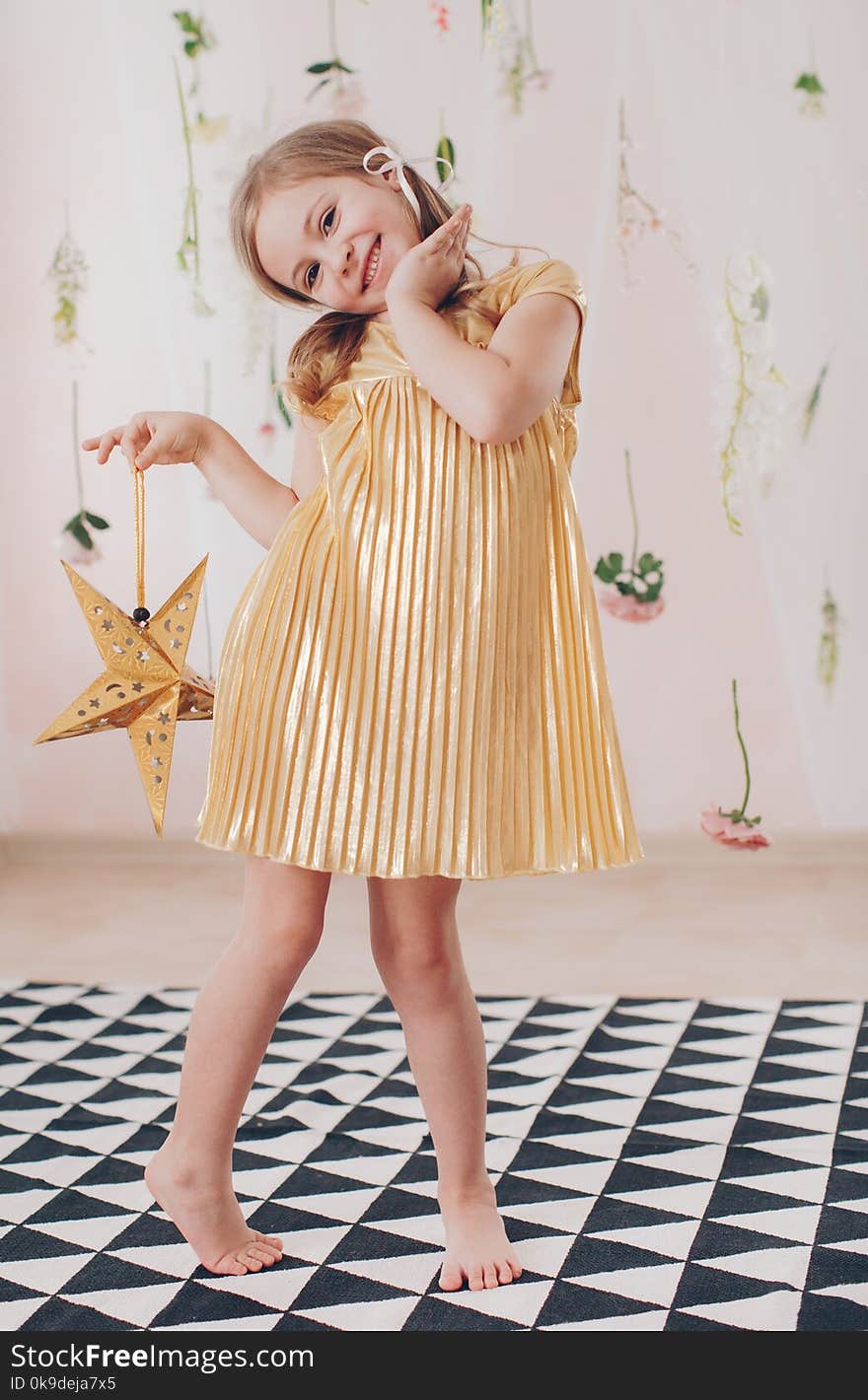 Beautiful happy girl photographed in studio in a beautiful dress