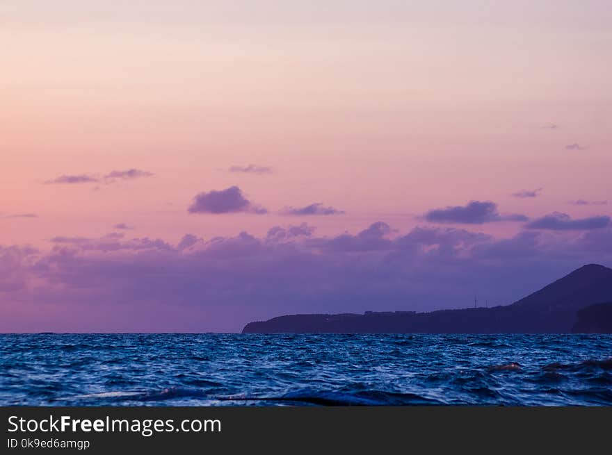 Summer sea sunset, the sun, waves and clouds, beautiful dramatic lighting. Summer sea sunset, the sun, waves and clouds, beautiful dramatic lighting