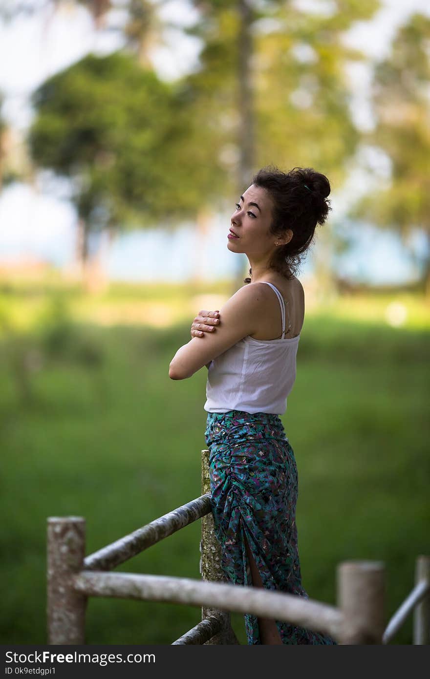 Fashionable girl of mixed race on an abandoned facility in the jungles of Asia. Fashionable girl of mixed race on an abandoned facility in the jungles of Asia.