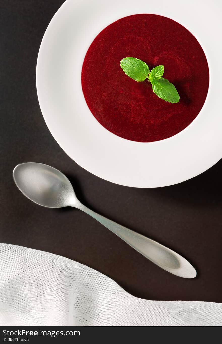 Organic Raw Beet Soup with a Mint Sprig Shot from Overhead. Organic Raw Beet Soup with a Mint Sprig Shot from Overhead