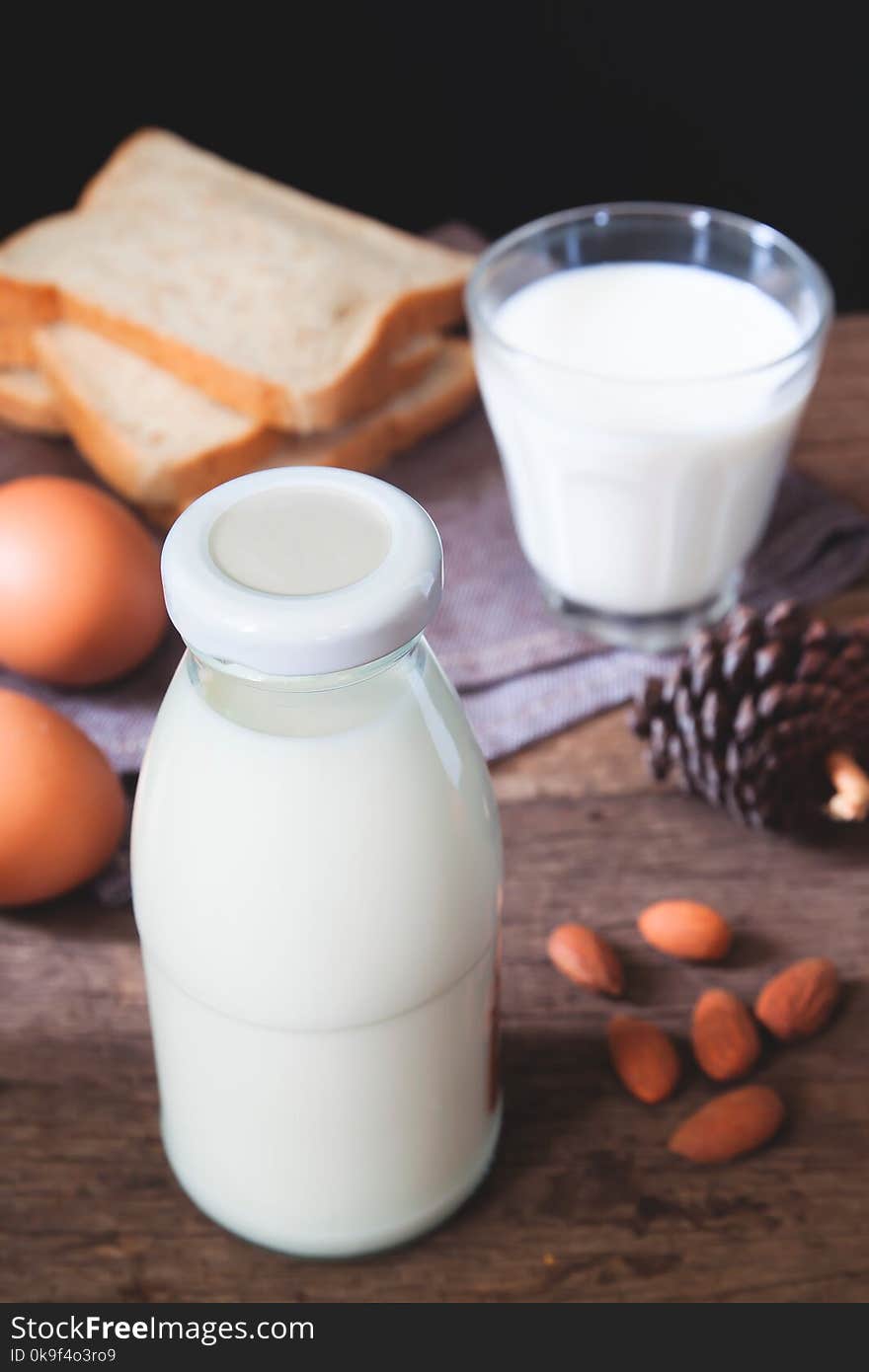 Almond milk bottle, sliced bread and boiled eggs, Healthy dairy