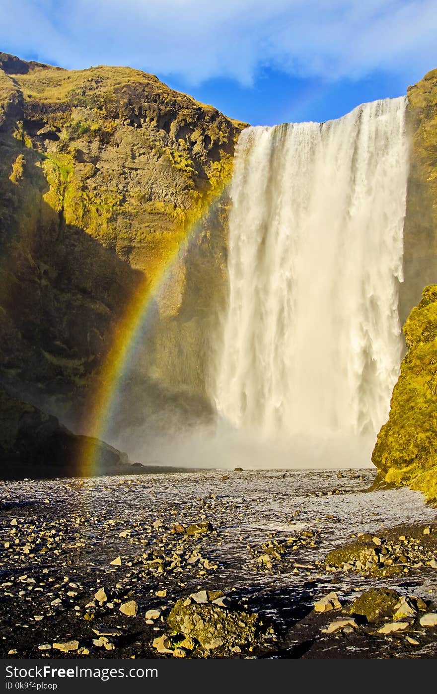 Rainbow at Skogafoss waterfall in southern Iceland along scenic ring road. Autumn season. Rainbow at Skogafoss waterfall in southern Iceland along scenic ring road. Autumn season.