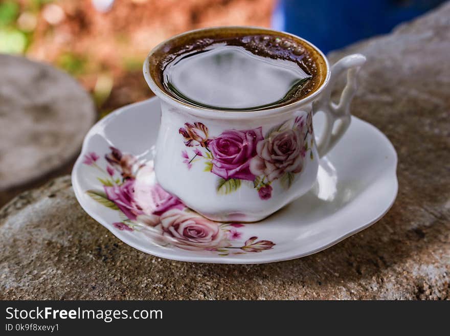 White and Pink Ceramic Floral Teacup With Saucer