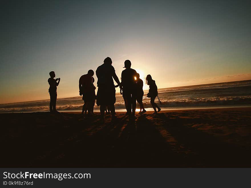 Silhouette Photo of People at the Seashore