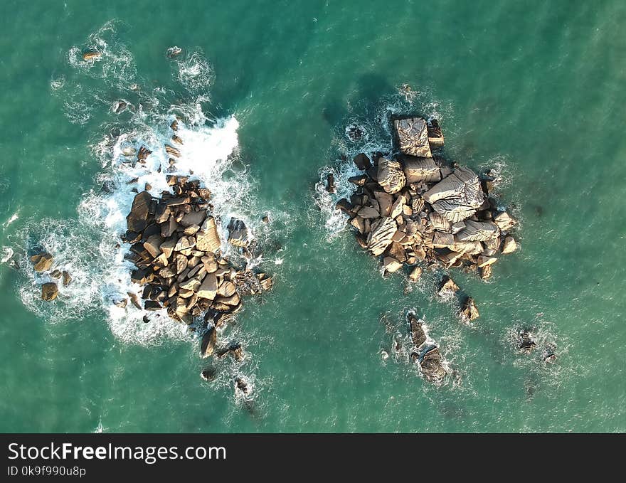 Bird&#x27;s Eye View of Rocks In Ocean