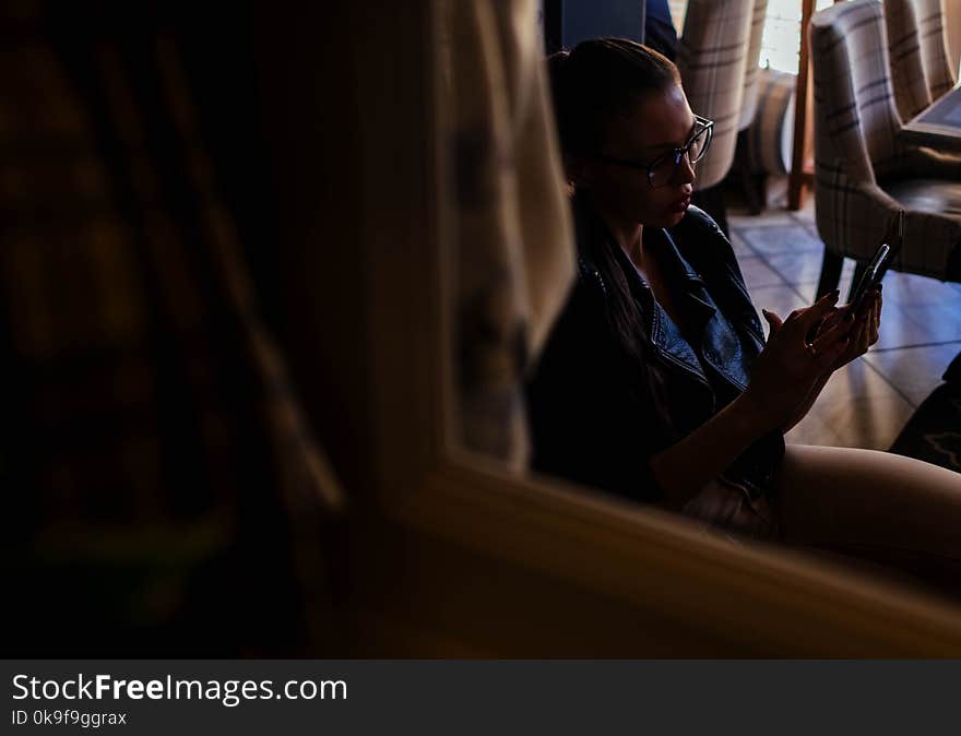 Woman Looking at Her Phone