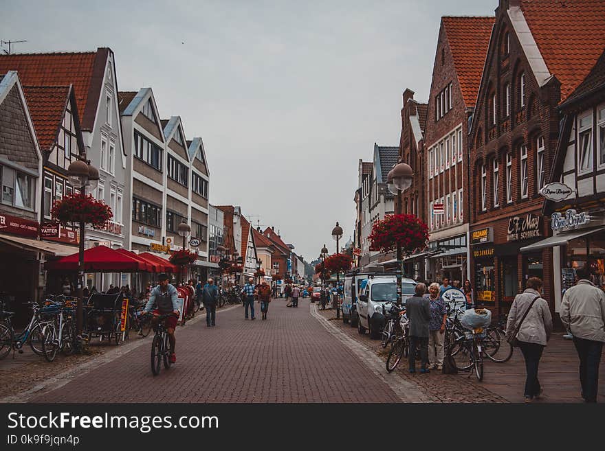 People Walking on Road Beside Buildings