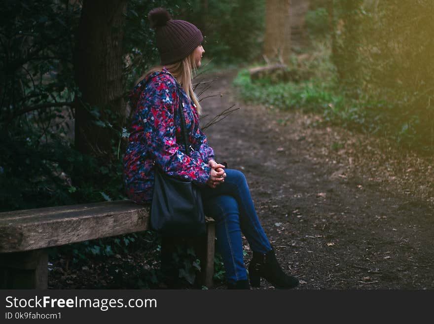 Photo of a Woman Wearing Blue Denim Jeans