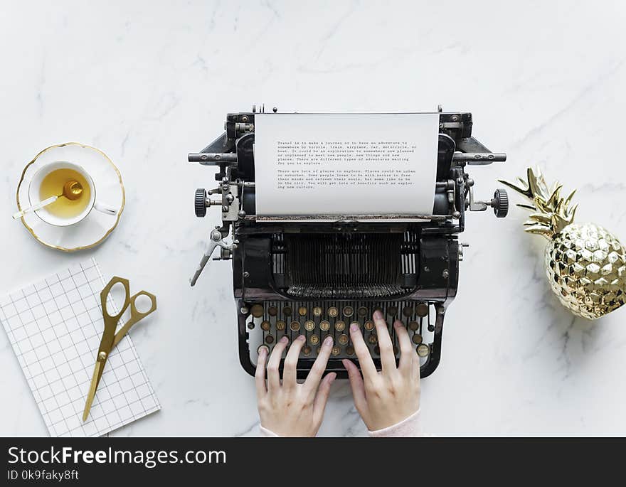 Person Typing On Typewriter