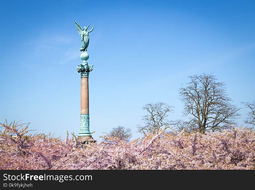 Copenhagen, Denmark - May 02, 2016: Ivar Huitfeldt monument at Langelinie Park and cherry blossom trees. Monument design by Vilhelm Dahlerup. Copenhagen, Denmark - May 02, 2016: Ivar Huitfeldt monument at Langelinie Park and cherry blossom trees. Monument design by Vilhelm Dahlerup.