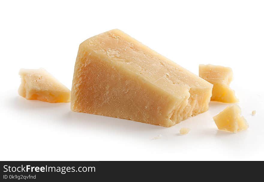 Isolated pieces of parmesan cheese on the white background