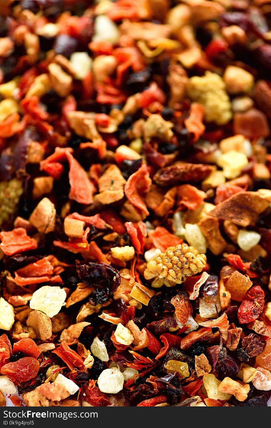 Mix tea karkade with dried fruits and flowers. Fruit tea background and texture. Top view. Food background. Organic