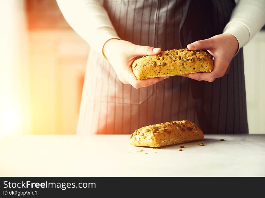 Woman Hands Holding Freshly Baked Bread. Bun, Cookie, Bakery Concept, Homemade Food, Healthy Eating. Copy Space. Banner.