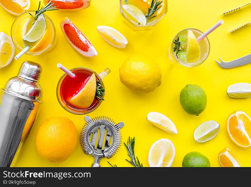 Mix Exotic Fruit Cocktail With Alcohol. Shaker And Strainer Near Citrus Fruits And Glass With Cocktail On Yellow