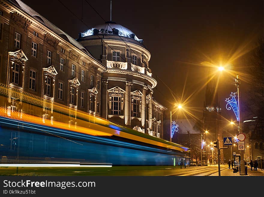 Street in front of the Medical University in Poznań at night