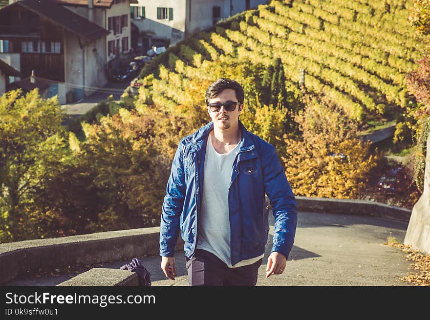 Photo of Man In Blue Jacket