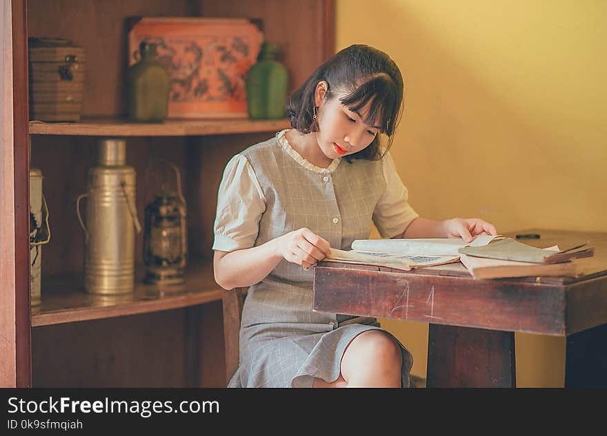 Photo of Short-haired Woman Reading