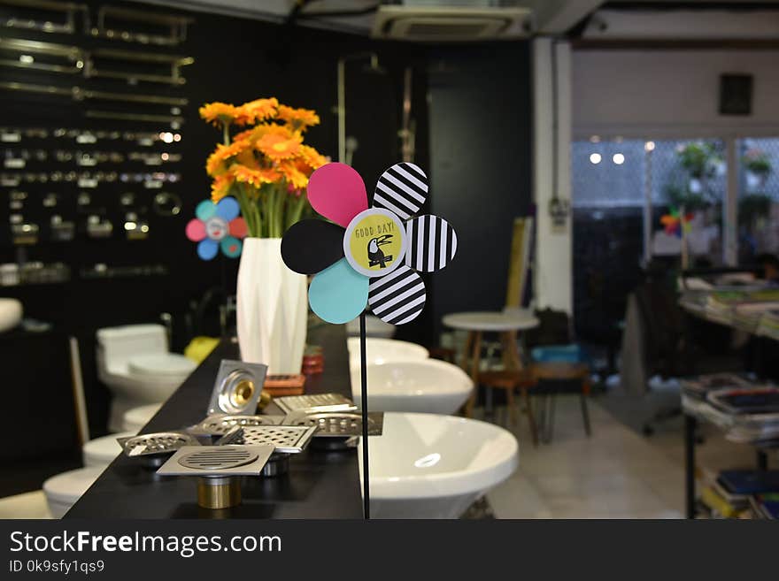 Assorted-color Flower Decoration Beside Stainless Steel Sink Holes