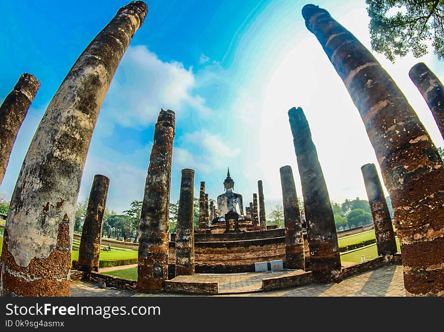 Brown Concrete Column Post on Grass