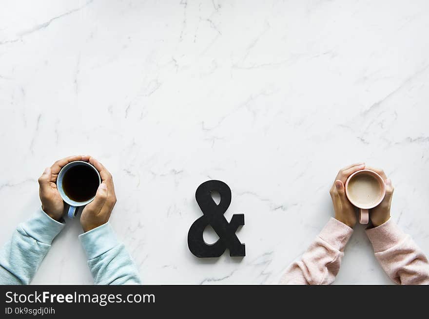 Two Brown and Blue Ceramic Mugs