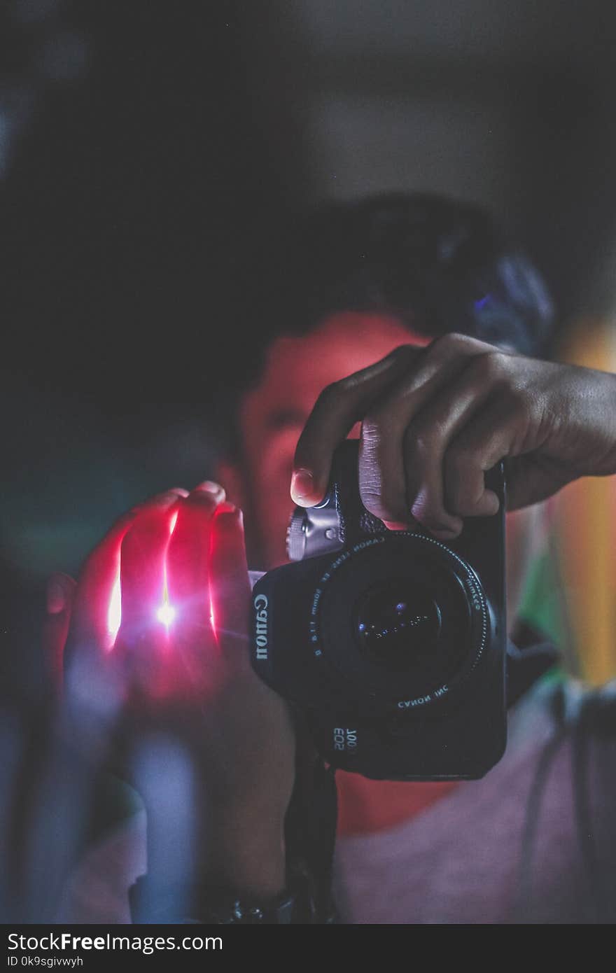 Person Holding Black Canon Dslr Camera