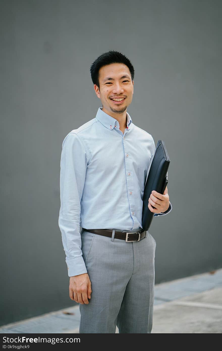 Man Holding Black Laptop Bag