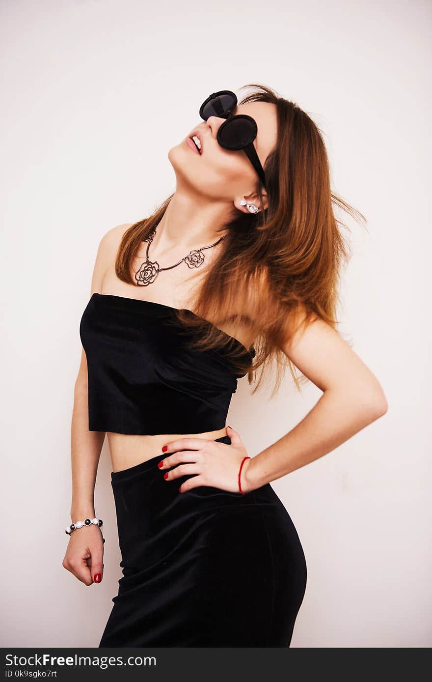 Woman Wearing Black Crop Top Standing Under White Background