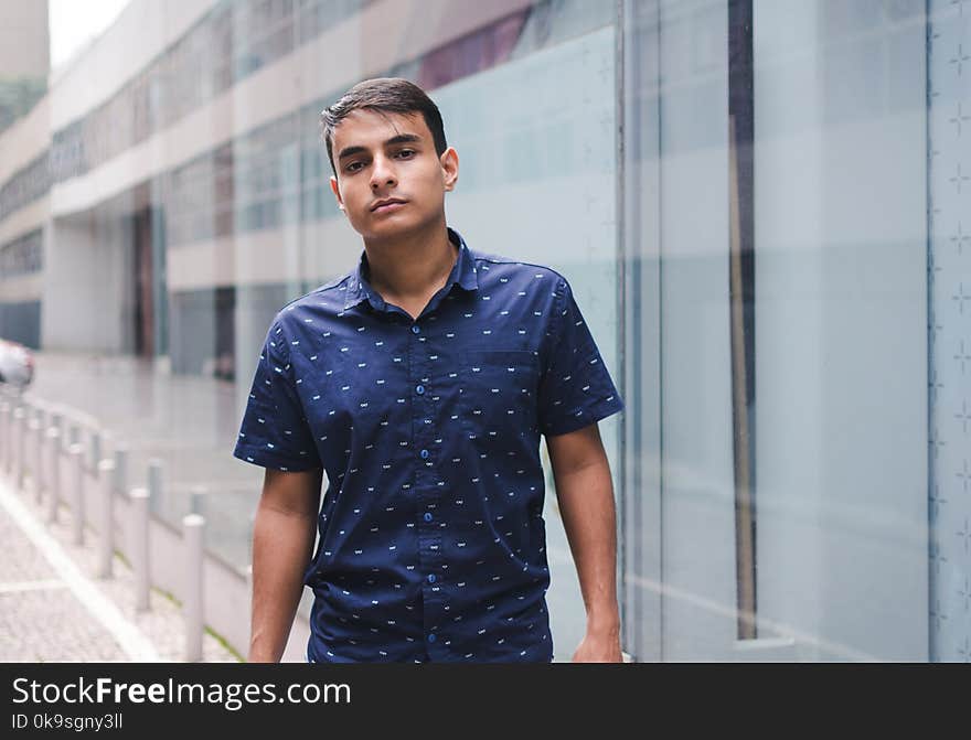 Man Wearing Blue and White Polka-dot Button-up Shirt