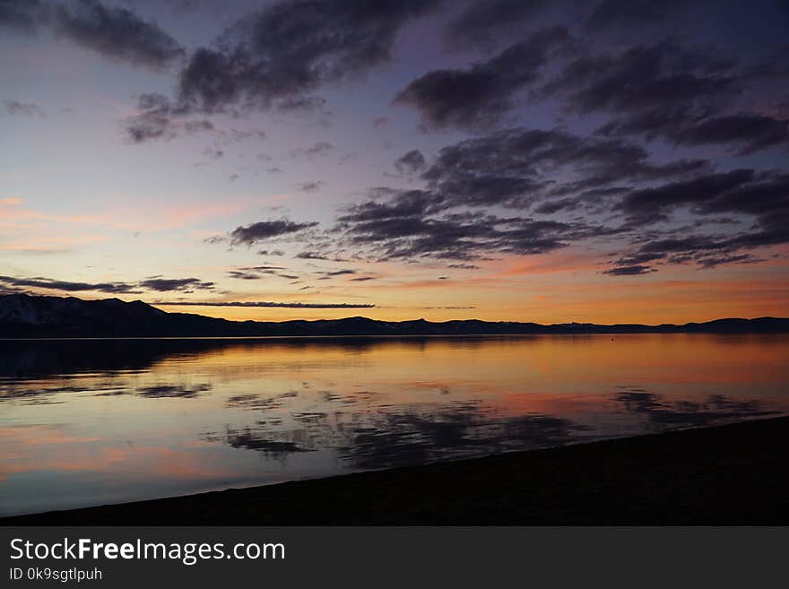 Silhouette of Mountain and Body of Water