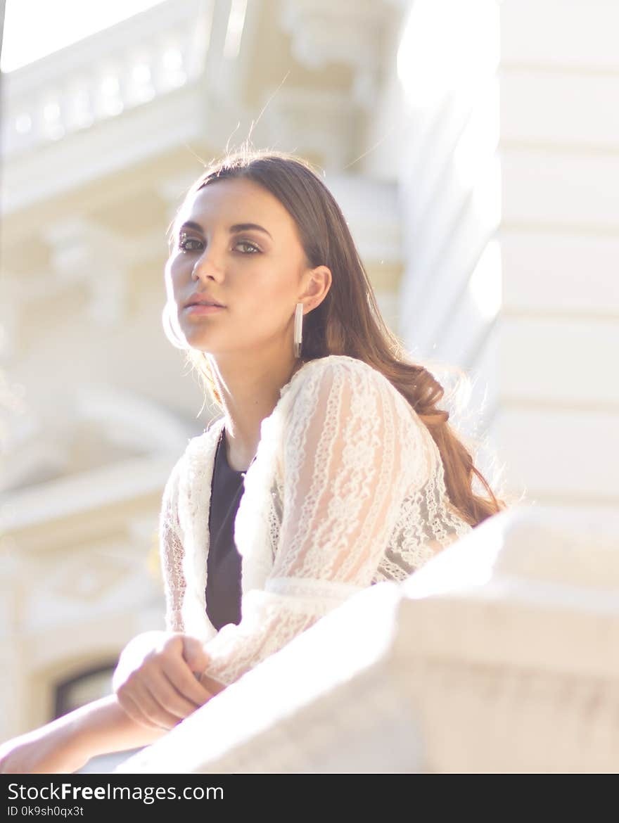 Woman Wearing White Lace Top