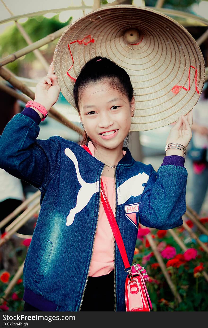 Girl In Blue Puma Denim Zip-up Jacket Smiling