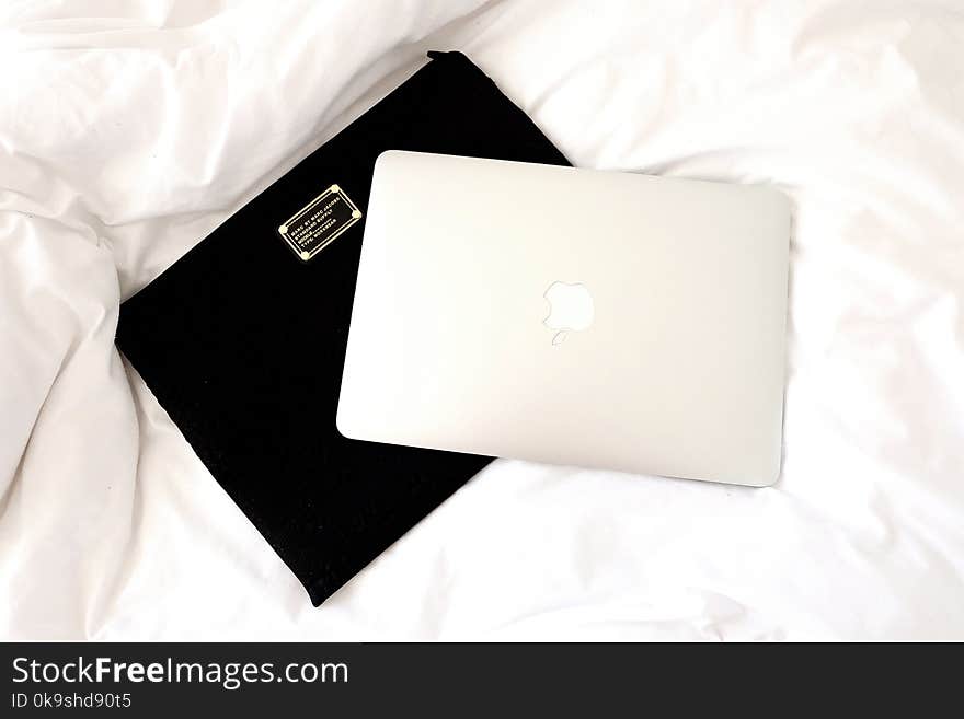 Silver Macbook on Black Case