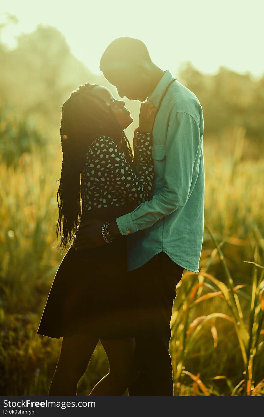 Photograph Of Man And Woman On Grass Field