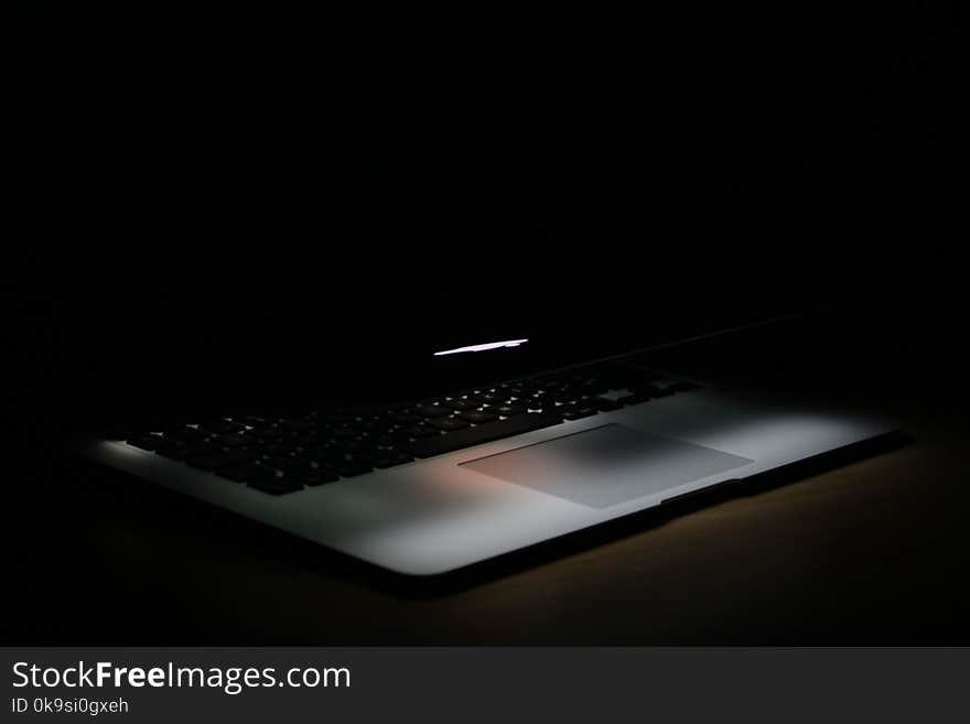 Photography of Laptop In a Dark Area