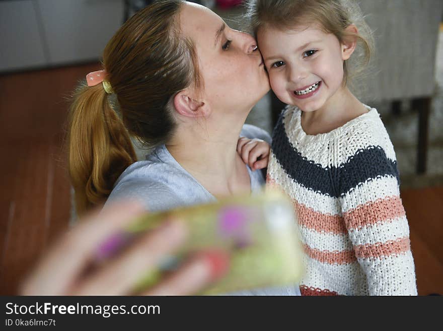 Young Mother Makes Selfie Photo With Daugther