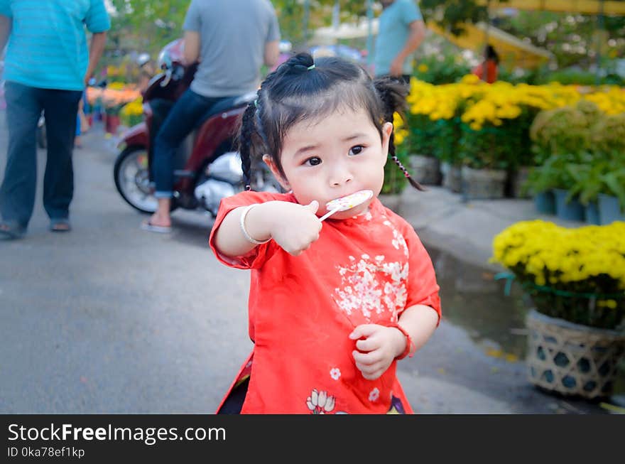 Girl Eating Lollipop