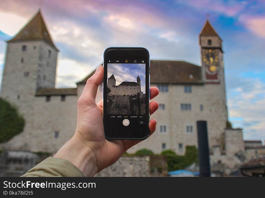 Person Holding Space Gray Iphone