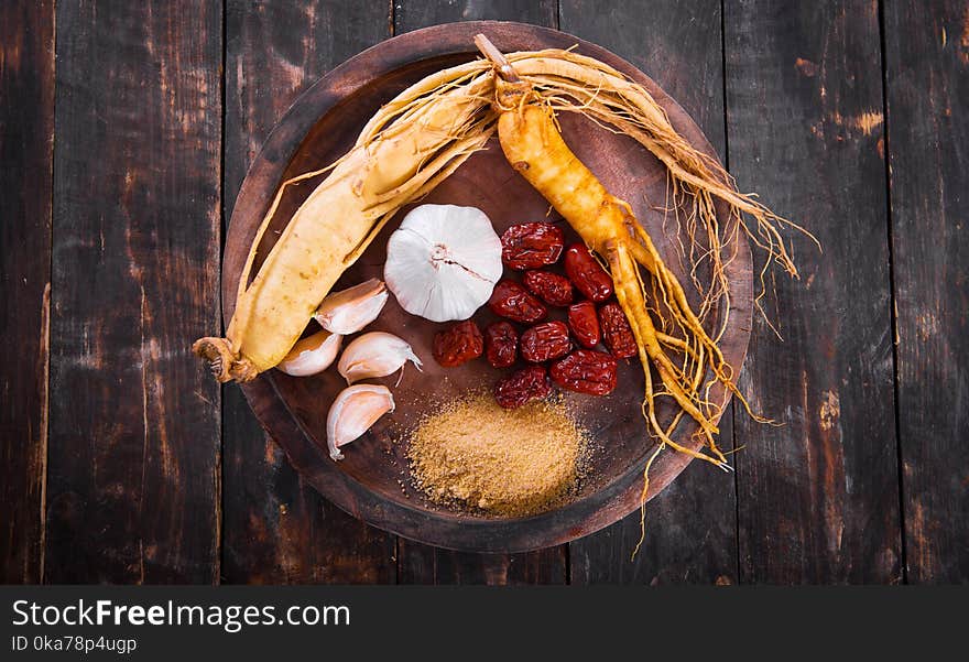 Assorted Spices In Round Brown Wooden Bowl