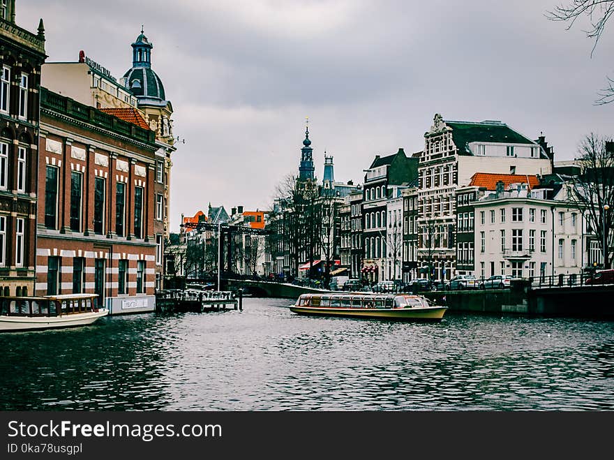 Boat On The Water Near Buildings