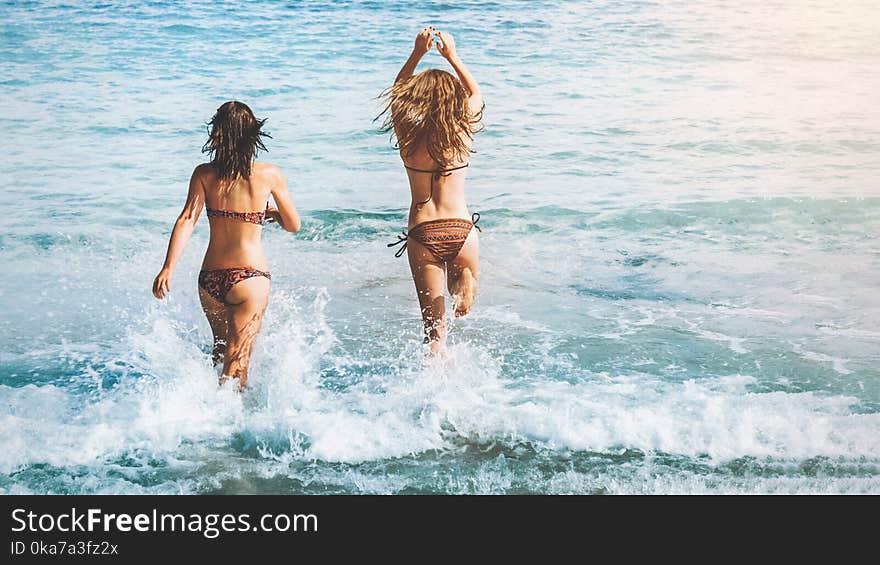 Two Women Wearing Bikini