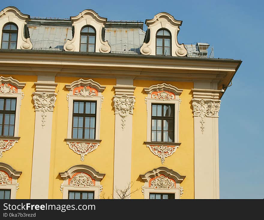 White And Yellow Painted Concrete Building