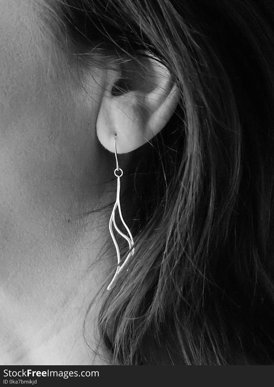 Grayscale Photo of Woman&#x27;s Hook Earrings