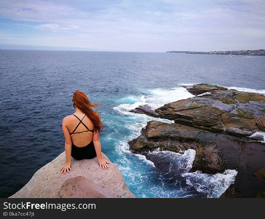 Woman Wearing Monokini on Rock Clip Near Body of Water