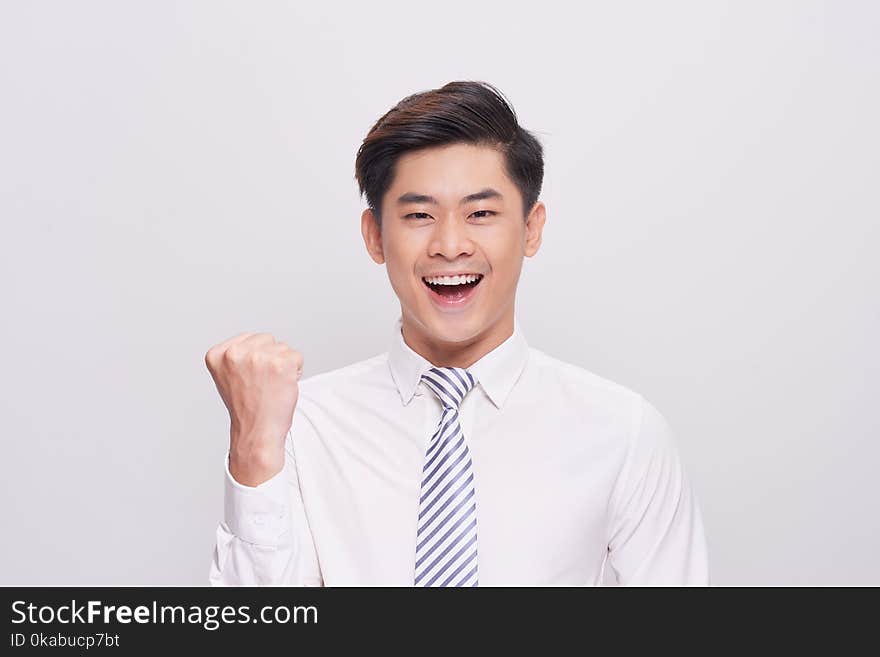 Portrait Of Happy Excited Young Asian Businessman